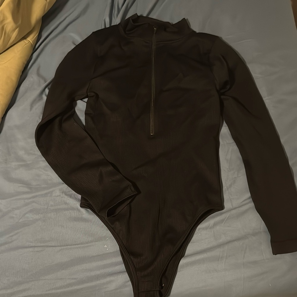 OQQ Half Zip Body Suits. Size large. Brown and Black. Ribbed Material
